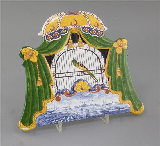 A Dutch Delft polychrome trompe-loeil bird plaque, first half 19th century, 20.5 x 24.5cm